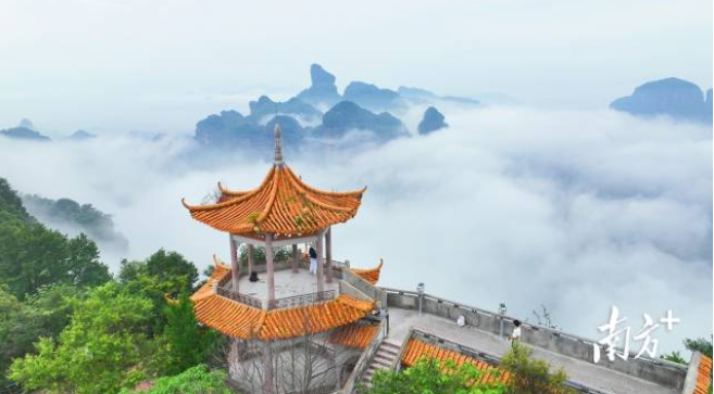 Cloud seas engulf Danxia, earthly realm cradles celestial | MicroInPixels